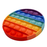 Side angle view of rainbow bubble popper fidget toy