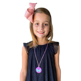 Girl wearing purple Munchables Butterfly Chew Necklace in USA.