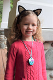 Munchables Girls Aqua Cupcake Sensory Chew Necklace Worn by Young Girl.