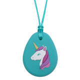Munchables Aqua Unicorn Chew Necklace features a white unicorn with a three coloured mane, an aqua eye and a yellow horn strung on an aqua cord.
