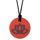 Munchables Lotus Chew Necklace with Coral Background and Gray Design.