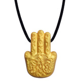 The Munchables Gold Hasma Hand Chew Necklace is a discreet, jewelry-like mindfulness tool.