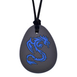 Munchables Dragon Chewy Necklace with black silicone pendant and red design.