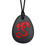 Munchables Dragon Chewelry Necklace with black silicone pendant and red design.