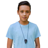 Munchables Arrowhead chewelry stim worn by teen boy.