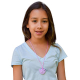 Girl wears Munchables Purple Bird Chewelry.