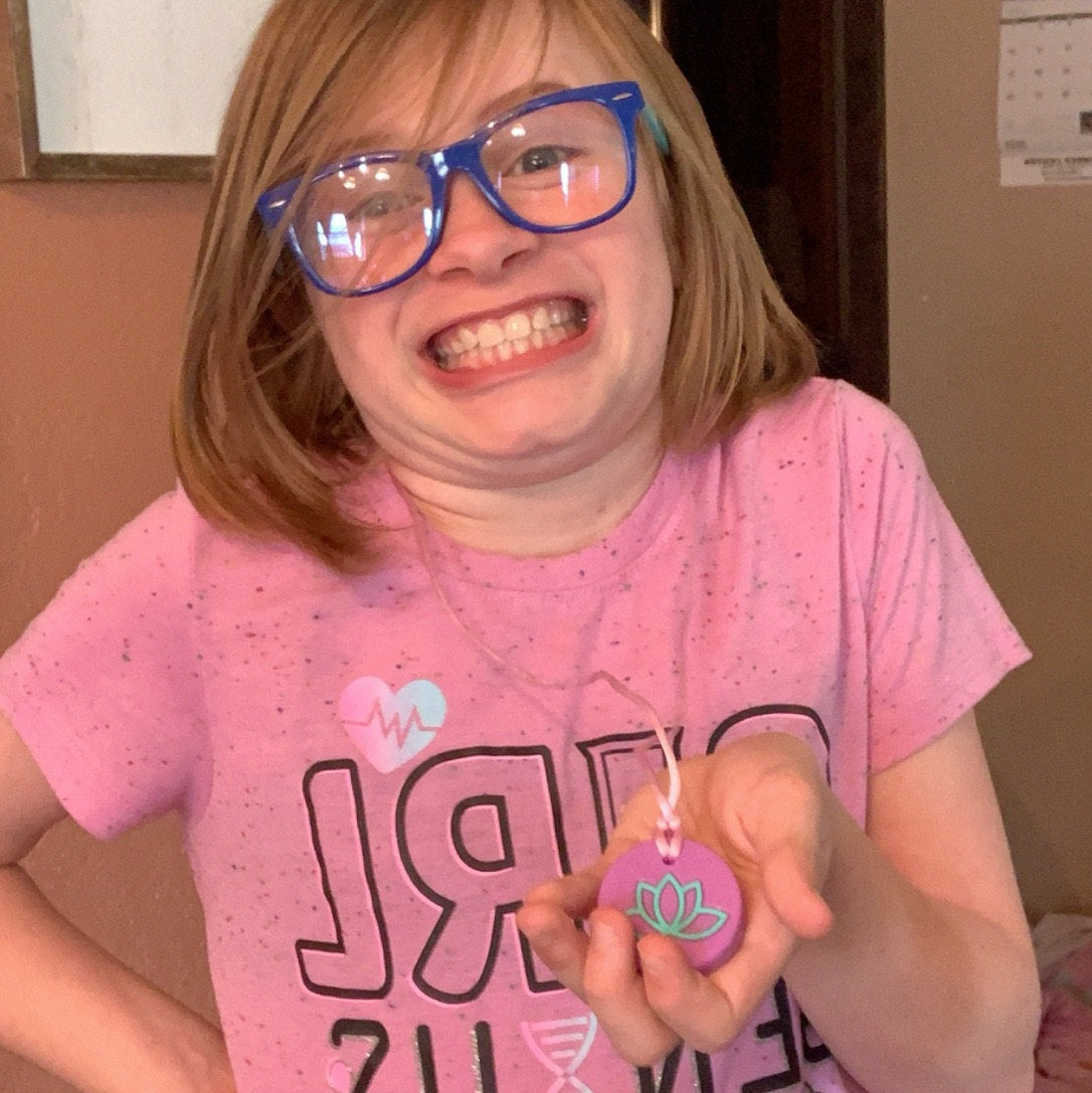 Munchables Lotus Chew Necklace worn by girl.