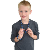 Munchables Midnight Blues Chew Necklace worn by a boy.
