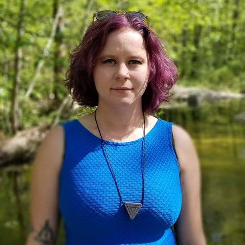Woman wears Munchables Triangle Adult Chewelry.