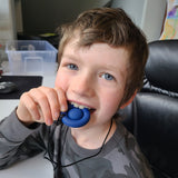Child chewing on Munchables Pop It Bubble Popper Fidget Sensory Chew Necklace