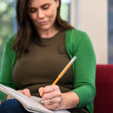 Adult Woman uses pencil with chewy tube pencil topper.