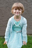 Young girl wearing pearls sensory chew necklace