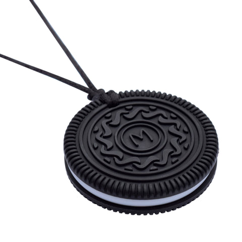 Munchables OREO like Chew Necklace on Black featuring an M in the center and a white middle section.