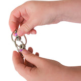 Child holds purple flippy chain fidget toy for stim