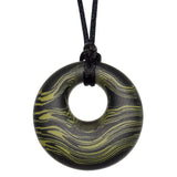 Munchables Green Scribbles Chew Necklace features wavy lines of dark green and black and is strung on a black cord.