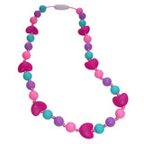 Munchables Chew Necklace with aqua, purple, pink round beads and fuchsia hearts.