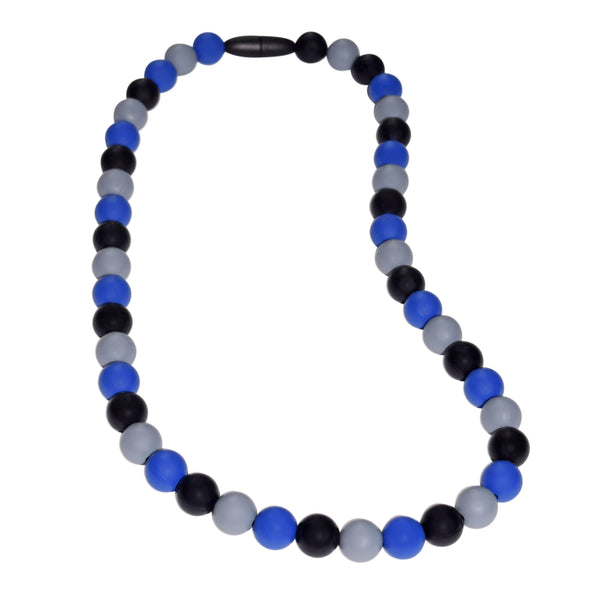 Munchables Midnight Blues Chew Necklace features black, gray and navy blue repeating beads and a black breakaway clasp.