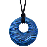 Munchables Navy Blue Scribbles Chew Necklace features wavy lines of blues and blacks and is strung on a black cord.