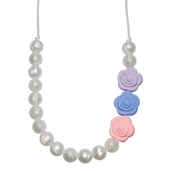 The Munchables Pearl Chew Necklace features pearl beads on only half the necklace and a lavender, blue and pink rose