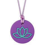 Munchables Lotus Adult Chew Necklace with Purple Background and Aqua Design.