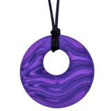 Munchables Purple Scribbles Chew Necklace features wavy lines of purples and is strung on a black cord.