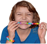 Munchables Rainbow Chew Necklace being chewed on by a girl.