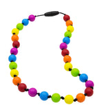 Munchables Rainbow Chewable Stim Necklace features 6 different coloured repeating round beads strung on a black cord with knots between each bead.