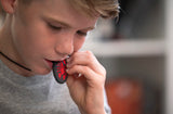 Boy chews on Munchables Red Scorpion Chewelry