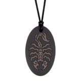Munchables black oval shaped chew necklace with gray scorpion design.