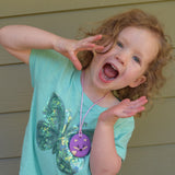 Munchables Round Fox Sensory Chew Necklace in Purple Worn by Preschool Girl.