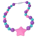 Munchables Starlight Chew Necklaces feature aqua, purple and pink beads in two sizes and a large pink star.