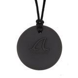 Munchables reverse side of shark chew necklace has a raised textured silicone