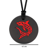 Munchables black chew necklace with red shark design measures 4.7cm in diameter
