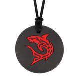 Munchables black chew necklace with red shark design