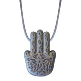 The Munchables Silver Hasma Hand Chew Necklace is a middle-eastern inspired mindfulness tool.