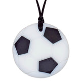 Munchables Soccer Chew Necklace in black and white strung on a black cord.