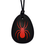 Munchables Spider Chew Necklace with Red Spider and Black Background.