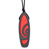 Munchables Surfboard Chew Necklace in black and red strung on a black cord.