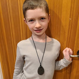 Boy wears Munchables Charcoal Waves Tear Drop Chewelry Necklace