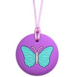 Munchables round purple butterfly chewable jewelry with light blue design.