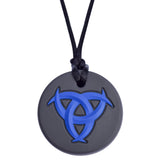 Munchables Celtic Chew Necklace with a black background and a blue raised design.