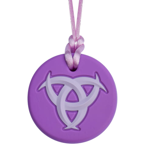 Munchables Celtic Chew Necklace with a purple background and a lighter purple raised design.