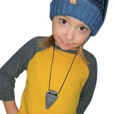 Munchables Arrowhead Sensory Chew Necklaces worn by young boy.