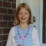 Girl Wearing Munchables Starlight Chew Necklace.