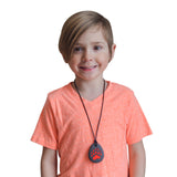 Munchables Bear Paw Chewable Necklace worn by young boy.
