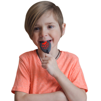 Munchables Bear Paw Chewelry chewed on by young boy.